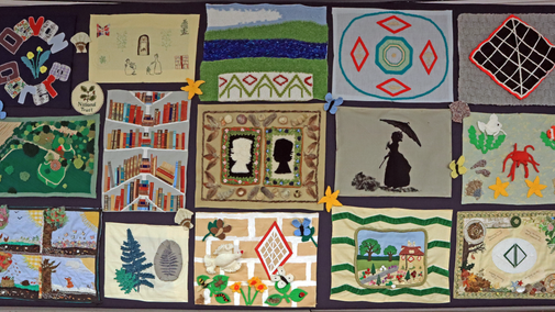 The finished quilt. Each panel was made by one of the group members and represents an element of A la Ronde they loved.